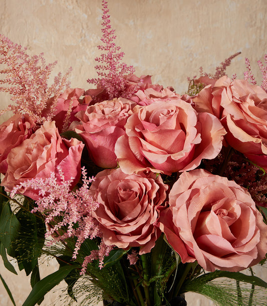 Blush Harmony rose vase with dusty rose, peach, and pink roses with pink astilbe arrangement