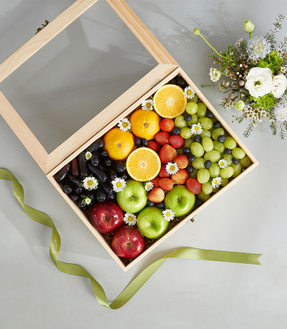 Premium wooden fruit gift box with fresh grapes, apples, strawberries, and blueberries for birthdays