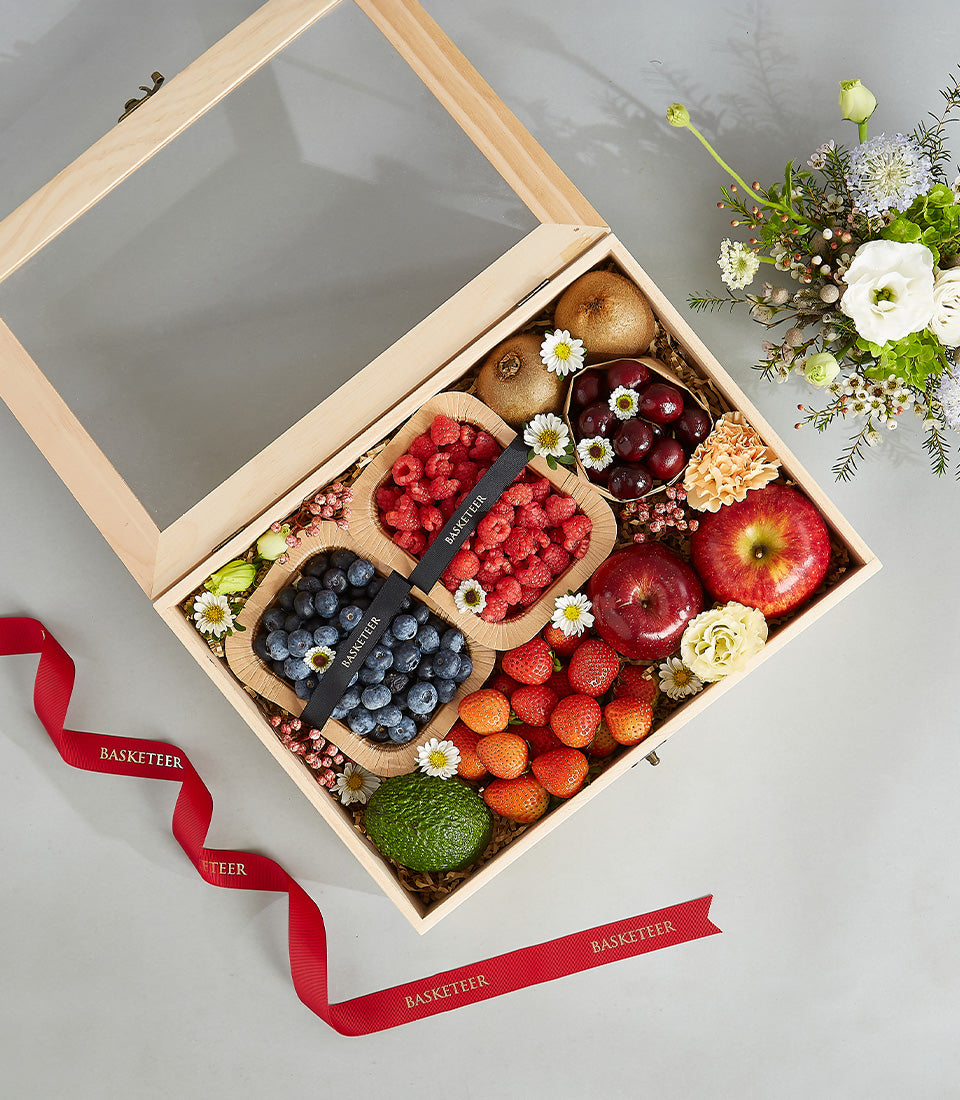 Premium wooden crate with fresh berries, kiwi, strawberries, and apples for birthday gifting