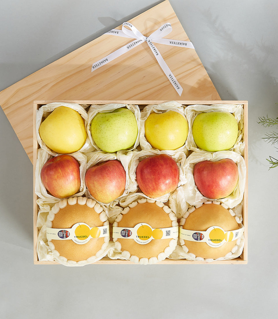 Premium wooden fruit gift box with fresh apples and pears, artisan wrapped in white tissue