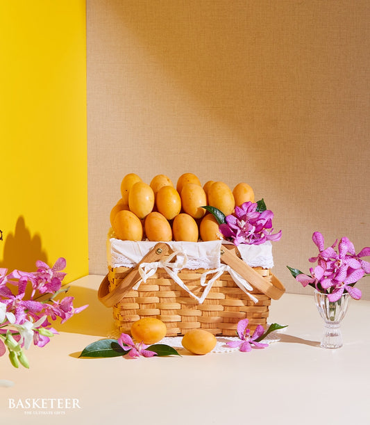 Premium marian plum tropical fruit basket with purple orchids and woven handles