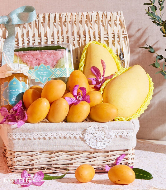 Thai organic mango and plum gift basket with sticky rice and jam, purple orchids, wicker presentation