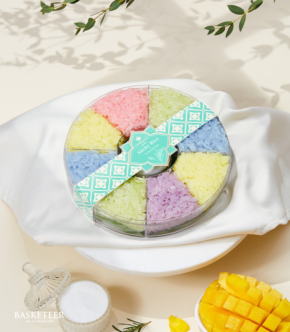 Pastel sticky rice gift box with eight colorful sections and teal ribbon, Charlotte Bakery artisan dessert