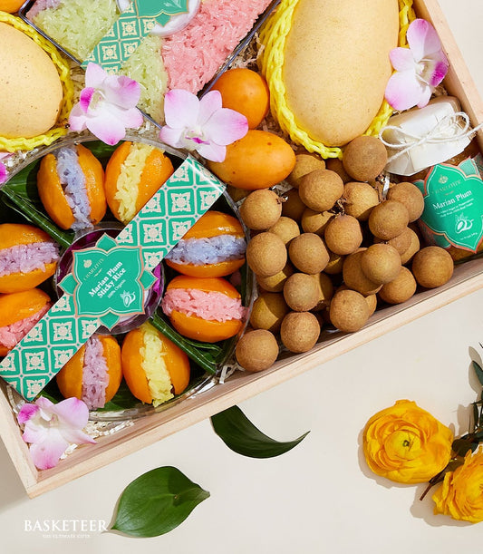 Thai summer fruits luxury gift box with mangoes, longans, Marian plums, sticky rice, and fresh orchids