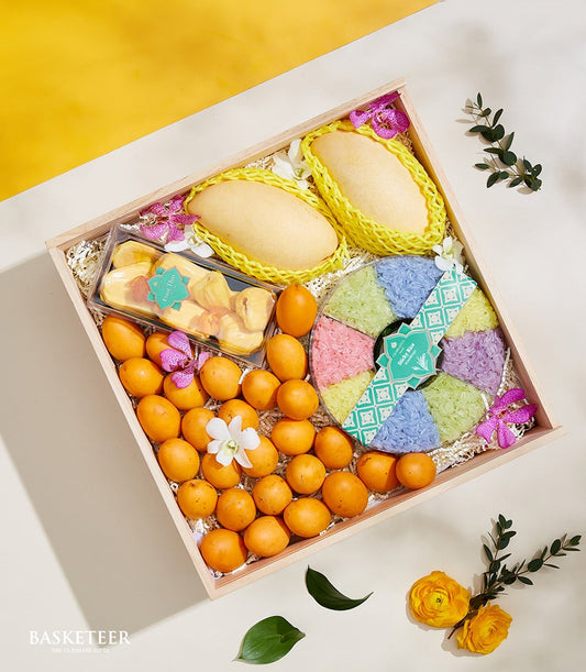 Luxury Thai fruit and sticky rice gift set with fresh mangoes, dried jackfruit, tropical fruits, and colorful artisan sticky