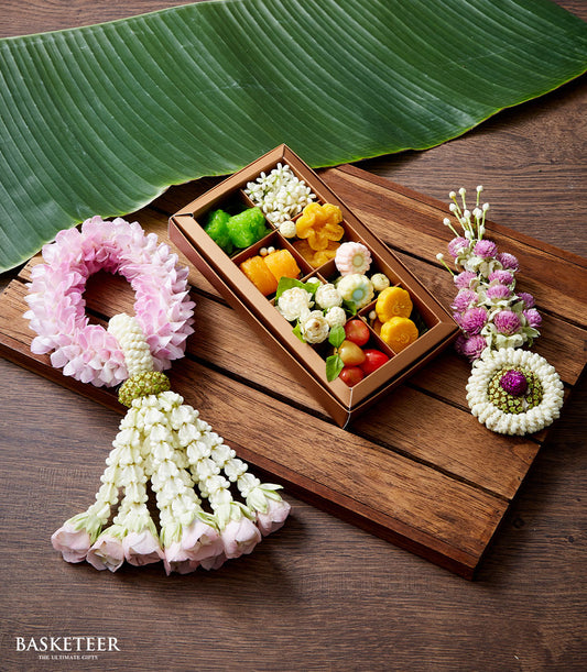 Premium Thai dessert gift set with jasmine flowers and traditional sweets for Songkran celebration