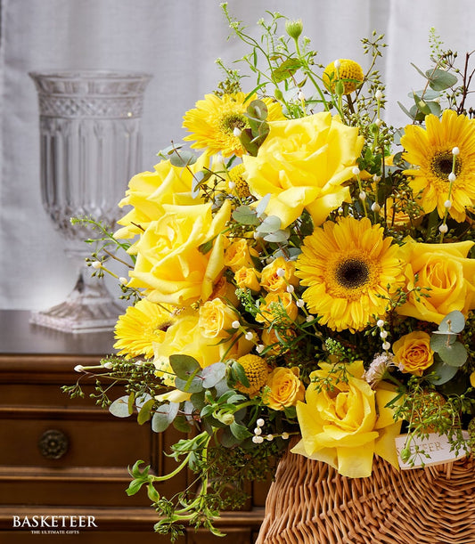 Yellow roses and gerbera daisies in woven basket for Songkran celebration