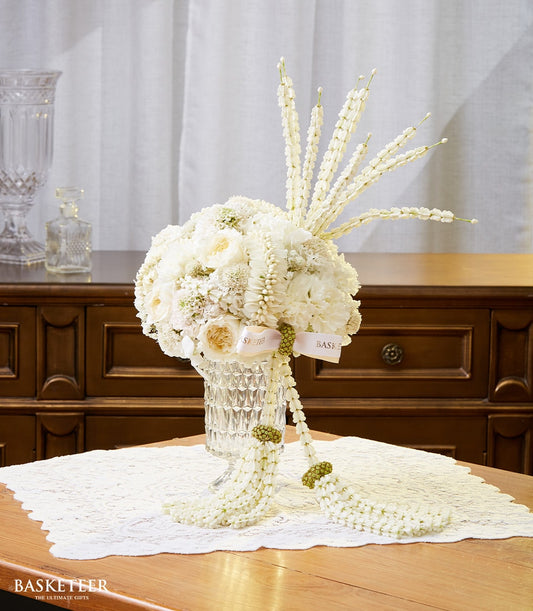 Premium white roses and jasmine Songkran centerpiece in crystal vase with cascading garland