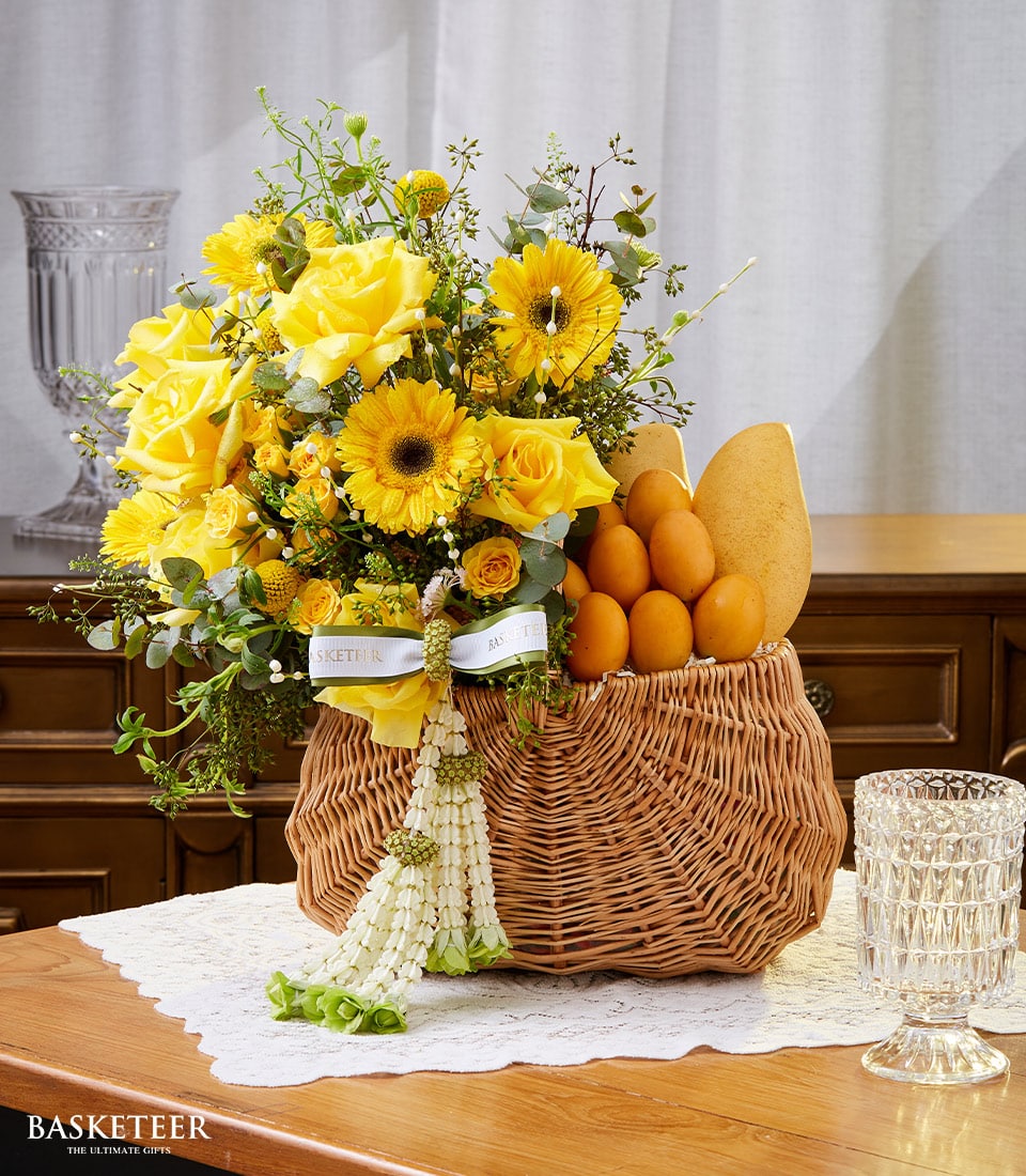 Yellow rose and mango gift basket for Thai New Year, woven wicker with fresh fruit arrangement