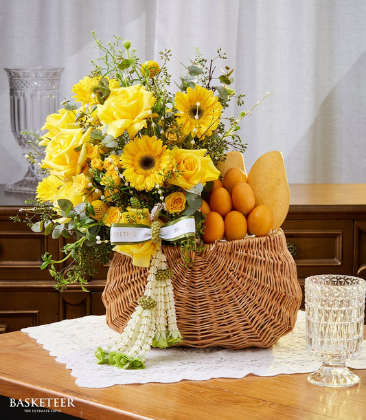 Yellow rose and mango gift basket for Thai New Year, woven wicker with fresh fruit arrangement