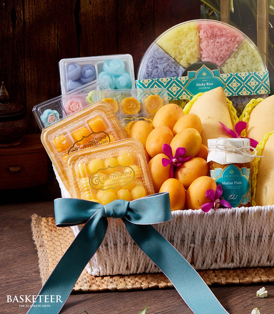 Luxury Thai tropical desserts gift basket with golden egg yolk sweets, colorful sticky rice, Marian plum jam, and fresh