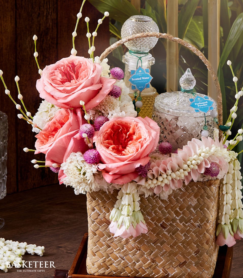 Pink rose floral gift basket with scented water and perfumed powder for Songkran celebrations