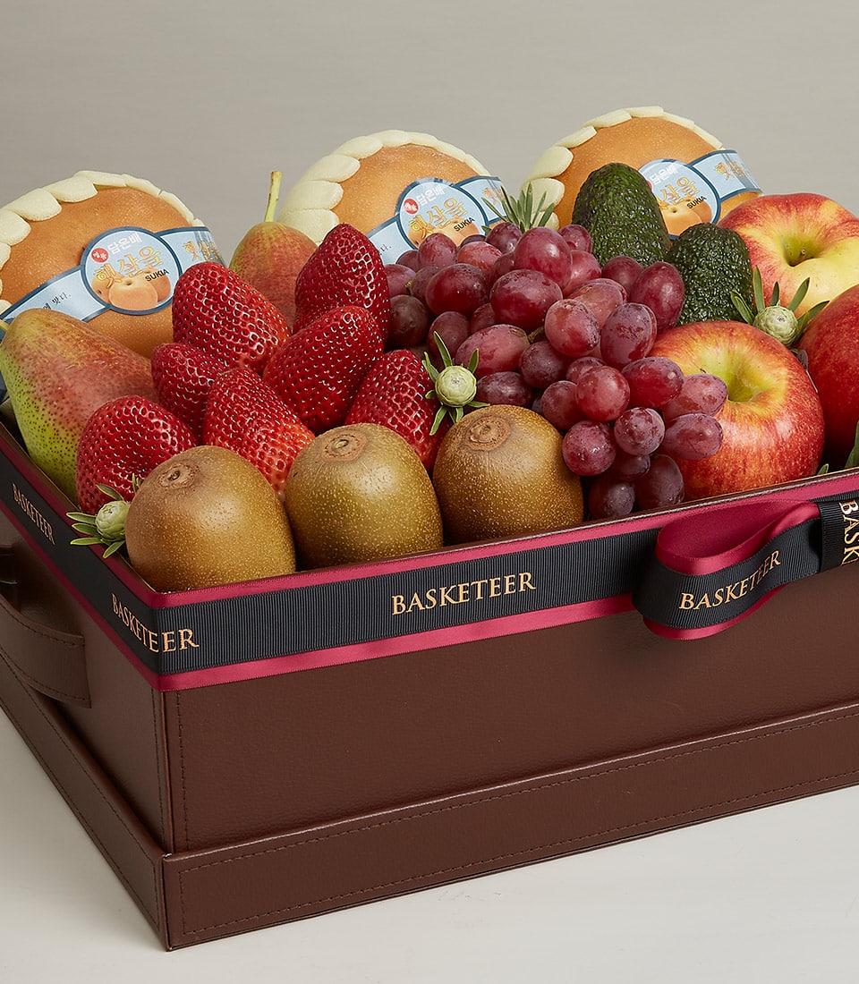 Luxury dark brown fruit gift box with fresh strawberries, kiwis, grapes, apples, and pears, adorned with black ribbon and