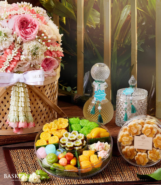 Premium pink and white roses with traditional Thai garland, perfume, and desserts for Songkran celebration