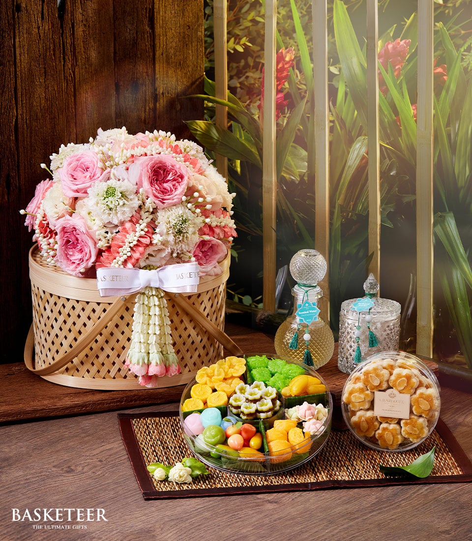 Pink and white rose bouquet with traditional Thai floral garland, desserts, and perfume gift set for Songkran