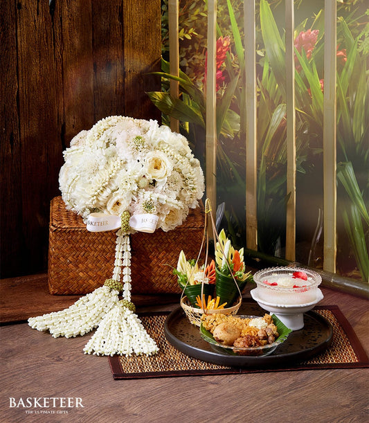 Premium white rose bouquet with khao chae and carved vegetables for Thai New Year celebration