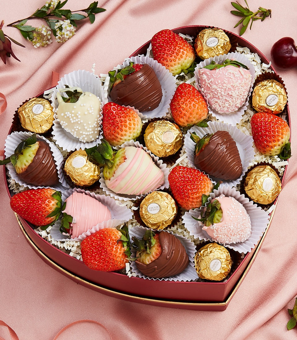 Red heart-shaped chocolate gift box with strawberry and Ferrero Rocher assortment for Valentine's Day
