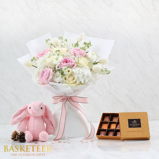 Pink and white roses with tulips, plush bunny, and gourmet chocolates birthday gift combo