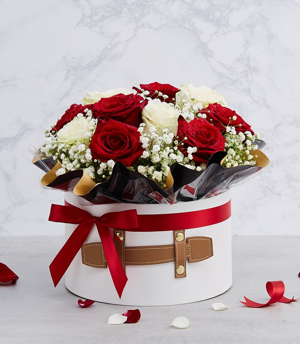 Luxury red and white roses with baby's breath in white gift box, red ribbon bow