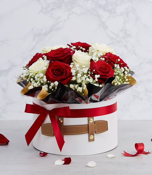 Luxury red and white roses with baby's breath in white gift box, red ribbon bow