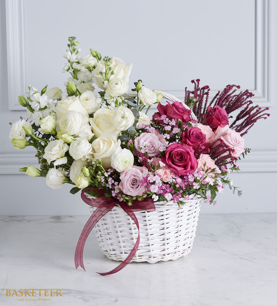 Tender Love get well flower basket with white roses, ranunculus, and pink spray roses in woven white basket