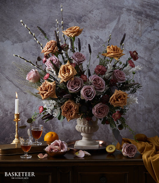Luxe dusty rose and mauve statement floral arrangement in classic urn vase with pussy willow and greenery
