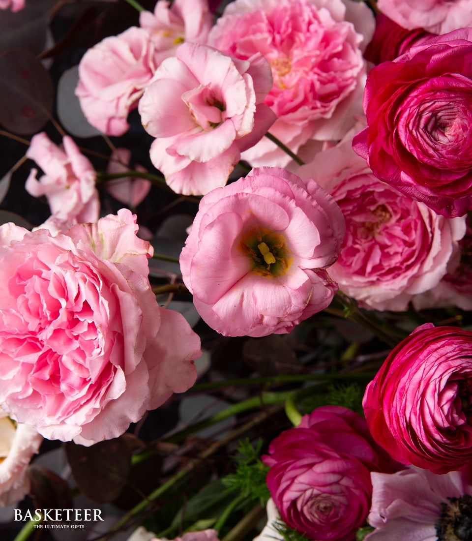Pink rose and lisianthus luxury flower arrangement in shades of fuchsia and pastel