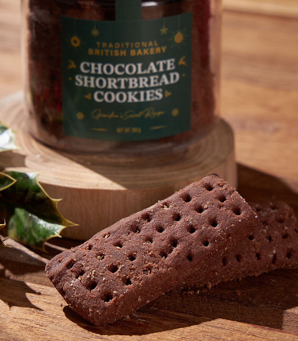 Classic British chocolate shortbread cookies in festive gift jar with holly, perfect for Christmas gifting