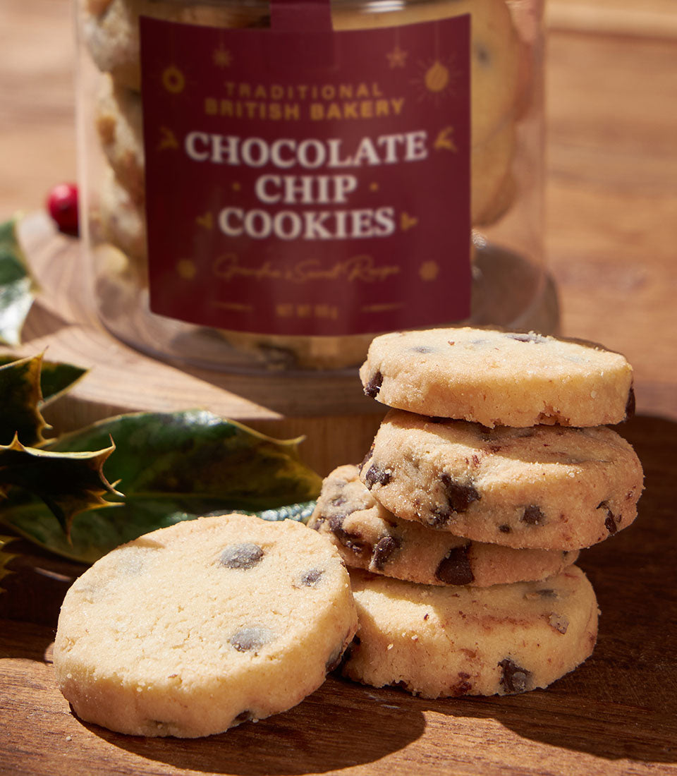 Classic British chocolate chip cookies in festive gift jar with holly accent