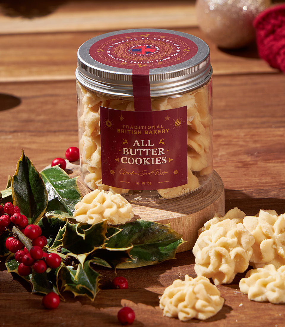 Classic British all-butter shortbread cookies in gift jar with festive holly and red ribbon