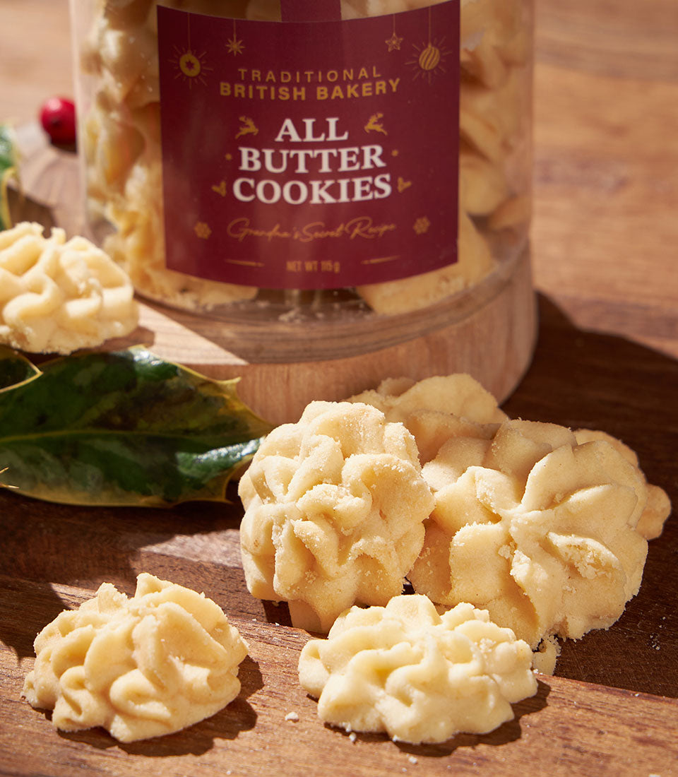 Classic British all-butter flower cookies in artisan jar, festive Christmas gift with holly and berry accents
