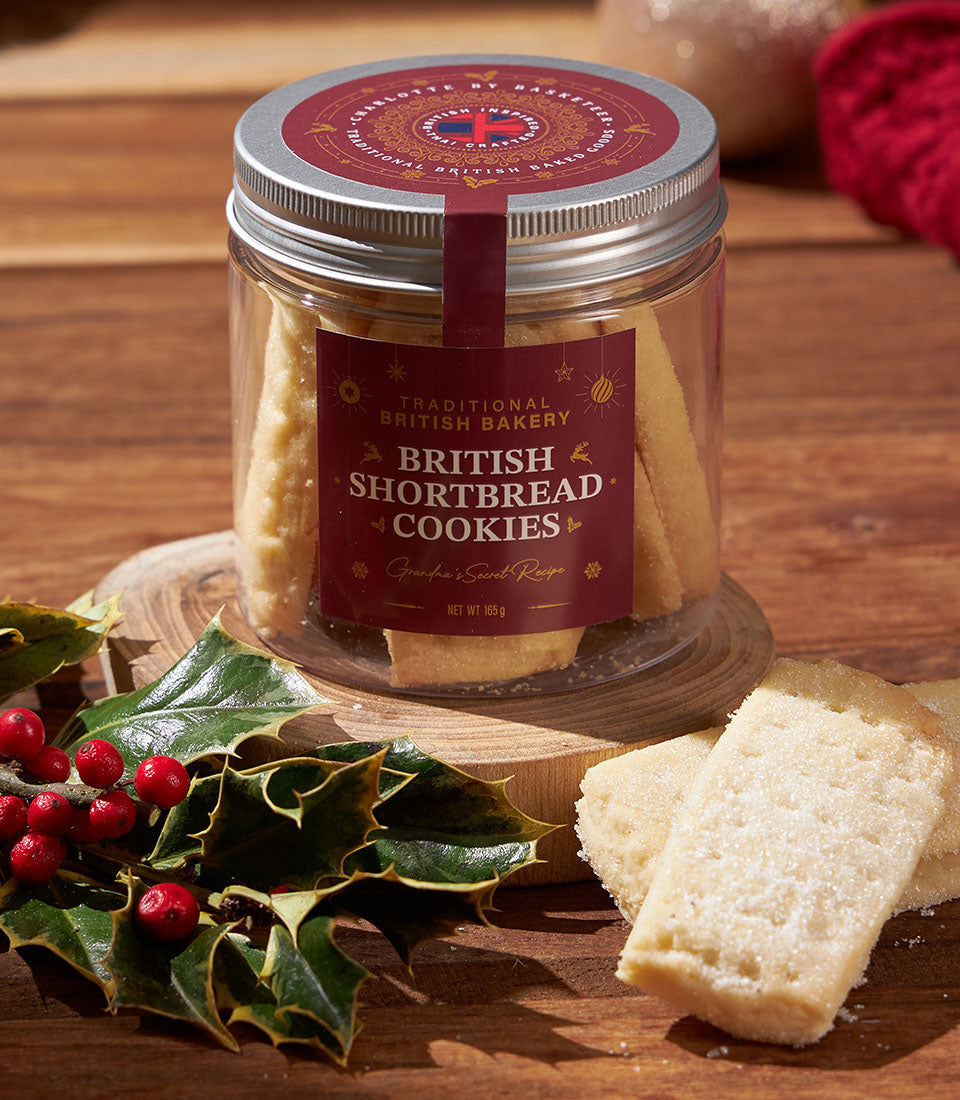 Traditional British shortbread cookies in festive jar with holly and red label for Christmas gifting