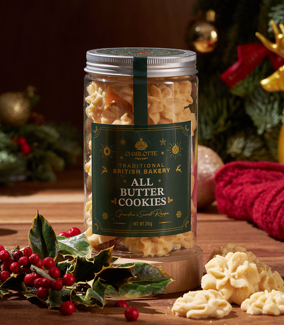 Jar of All Butter Cookies from Charlotte Bakery, a British bakery in Thailand. Artisan cookies sit on a wooden board with festive decor. Perfect gift.
