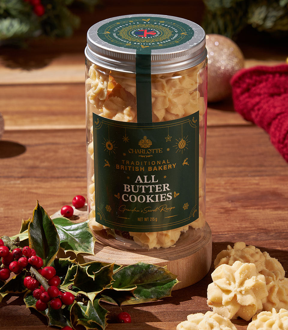 Star-shaped butter cookies in glass jar, Charlotte Bakery Christmas gift with holly and festive gold label