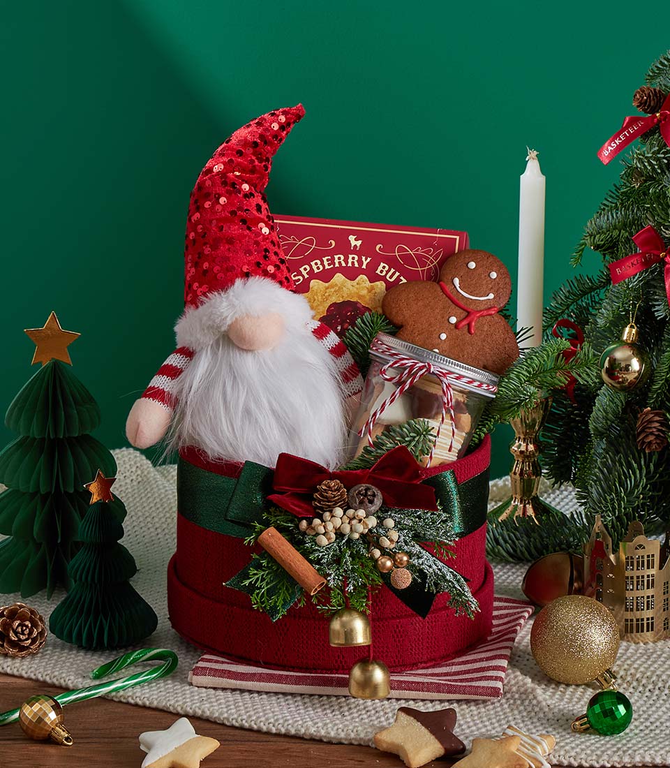 Red Christmas hatbox with plush gnome, festive cookies, and gourmet treats gift set