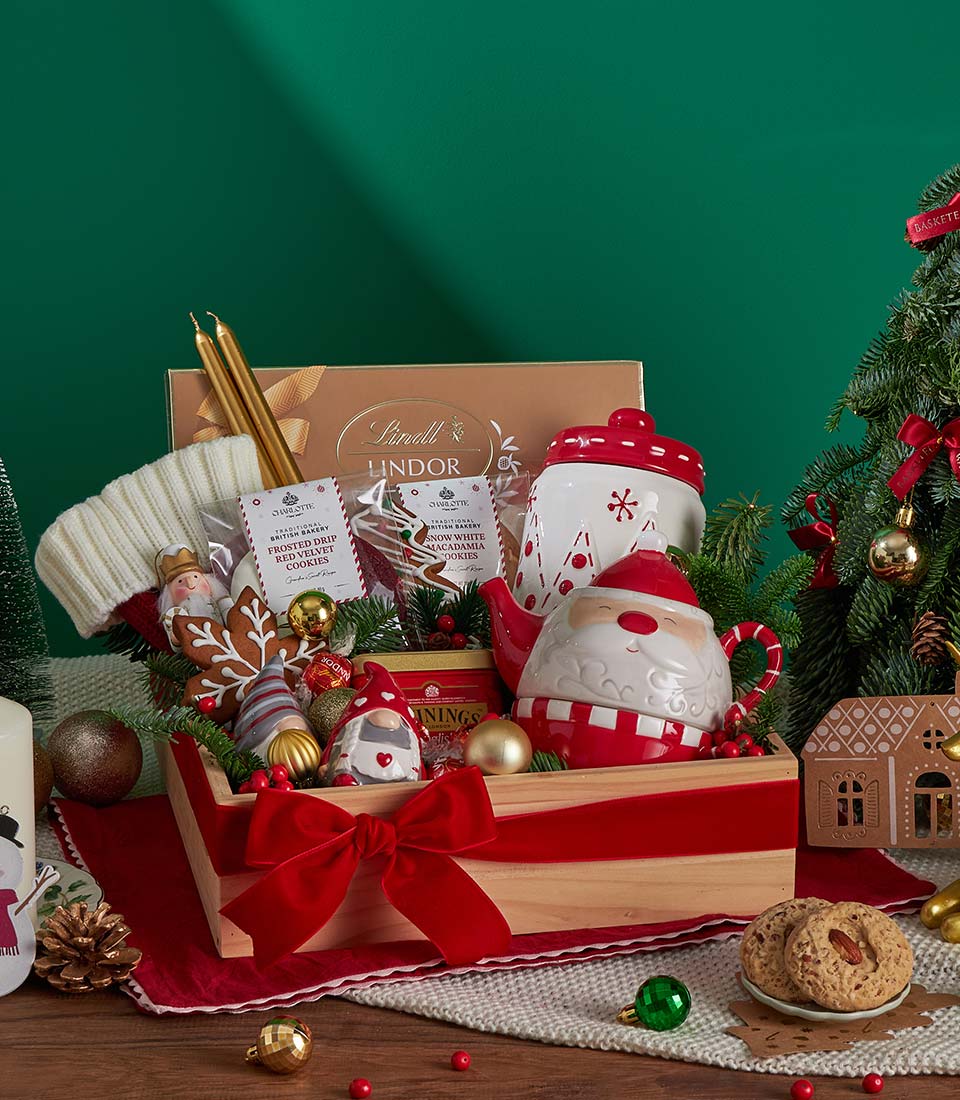 Luxury Christmas tea, cookies and chocolate gift set in wooden crate with red velvet bow, festive holiday hamper