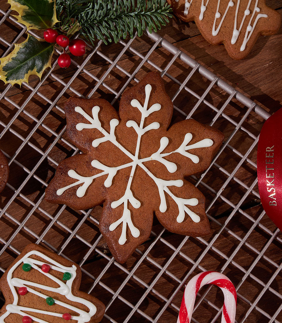 Artisan gingerbread cookies from Charlotte Bakery, iced with festive white designs. Order British bakery treats in Bangkok.