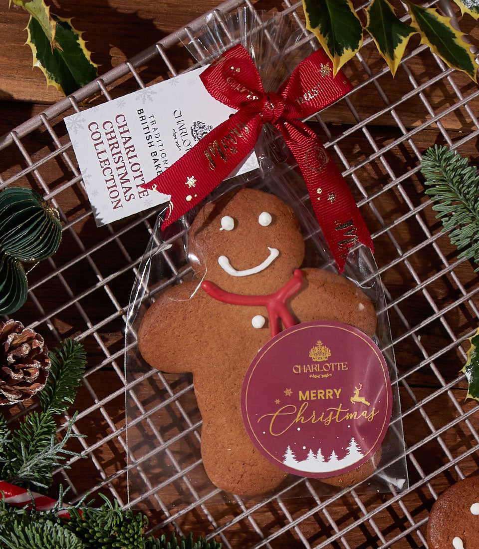 Charlotte Bakery gingerbread cookie, festive treat in Bangkok. Packaged with a red ribbon, a perfect artisan gift.