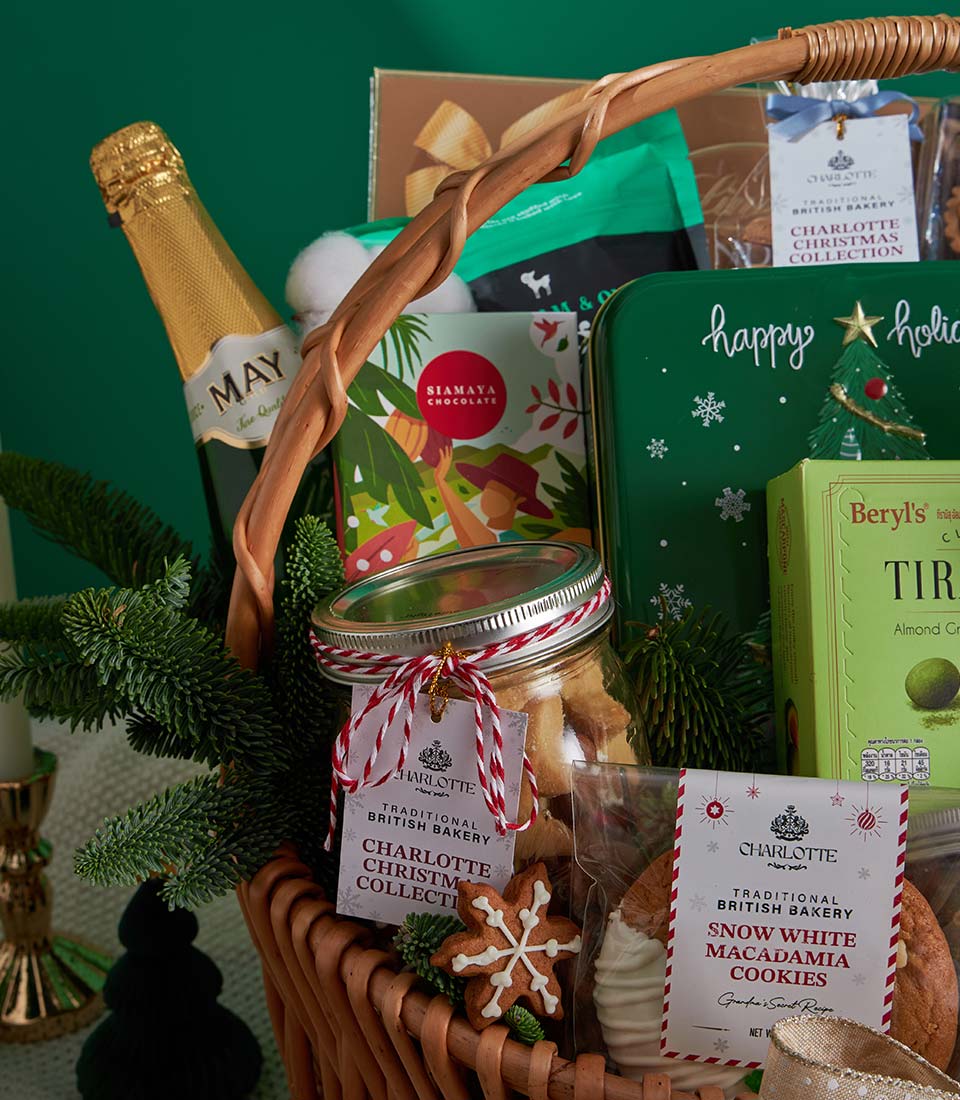 Premium Christmas gourmet basket with sparkling wine, artisan chocolates, Charlotte Bakery baked goods, and festive treats