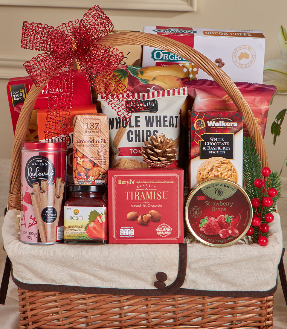 Premium red and gold New Year gift basket with gourmet snacks, wafers, chocolate, and jam in woven wicker