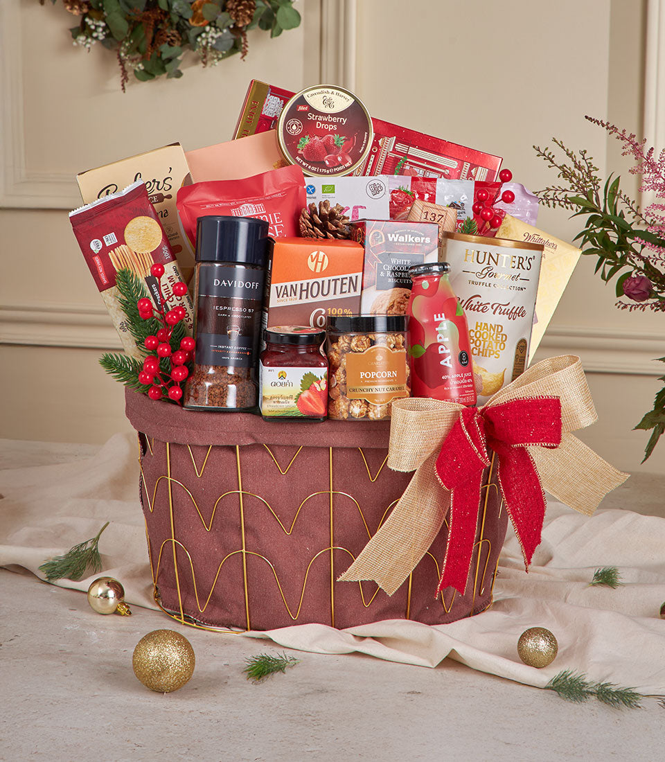 Luxury red gourmet snack gift basket with coffee, chocolate, jam, and festive gold accents for New Year