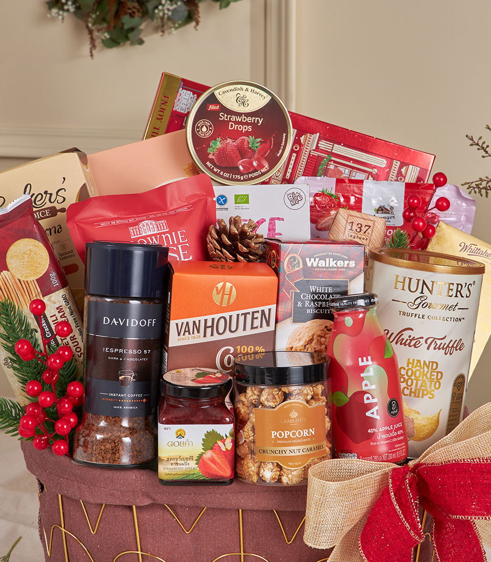 Deluxe red gourmet snack basket with chocolate, coffee, strawberry spread, and caramel popcorn for New Year gifting