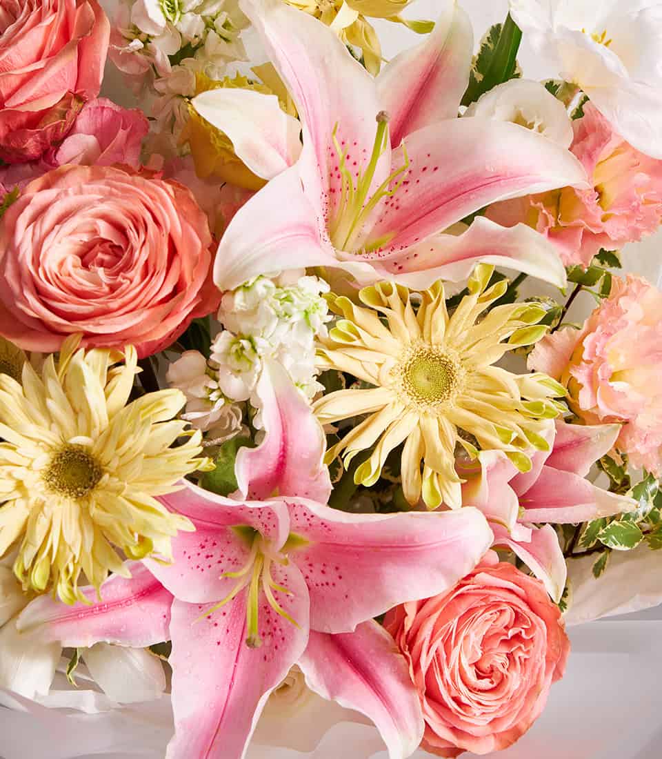 Pink lilies and peach roses champagne bouquet for anniversaries