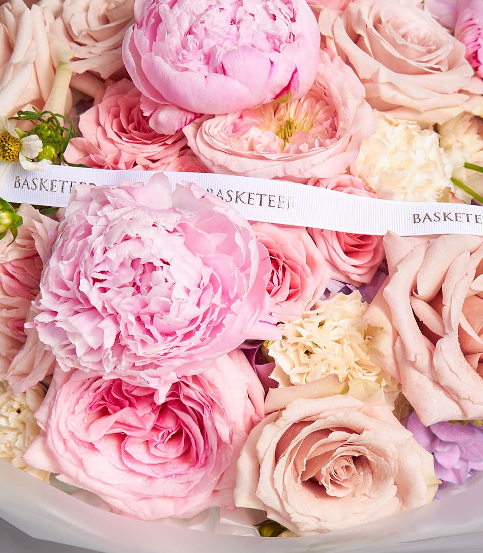 Blush peony and rose bouquet with cream carnations and fresh Ecuador roses