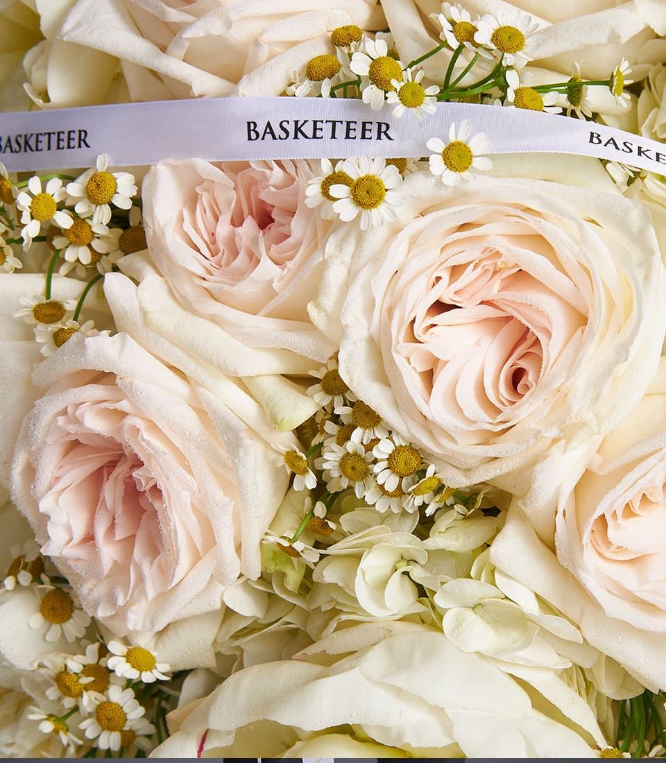 Ivory Bloom mixed bouquet with light pink roses, white hydrangeas, and chamomile flowers