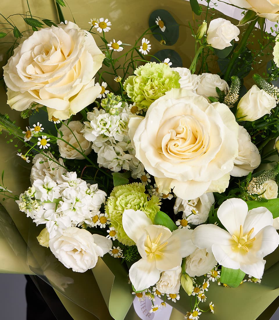 Cream rose and green carnation fresh flower bouquet with white stock and tulips