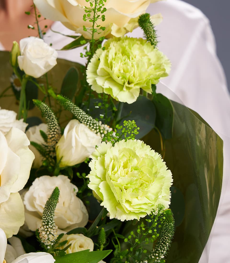 Cream roses and green carnations hand-tied bouquet with veronica and foliage