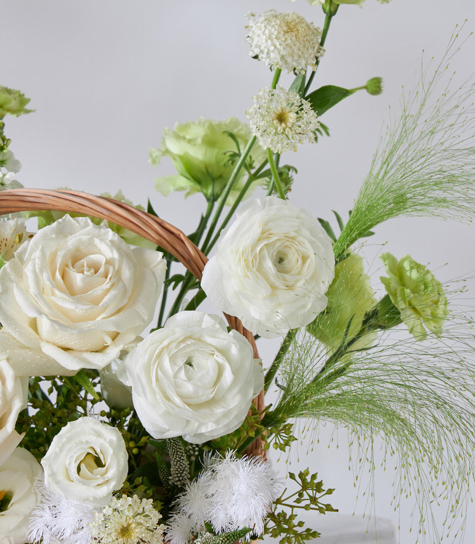 White and green rose flower basket with ranunculus and lisianthus, elegant birthday gift arrangement