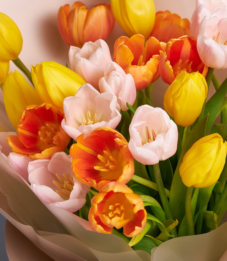 Yellow, orange and blush tulip bouquet with natural paper wrap, premium fresh flowers for gifting