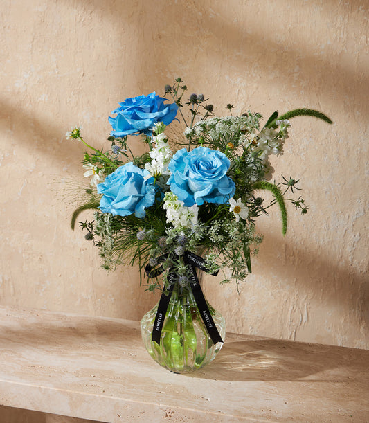Premium blue rose vase arrangement with white florals and thistle accents, fresh flower gift